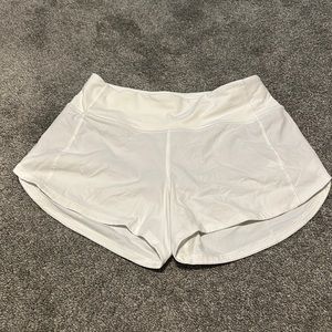 lululemon white speed ups size 4 and 4 inches.